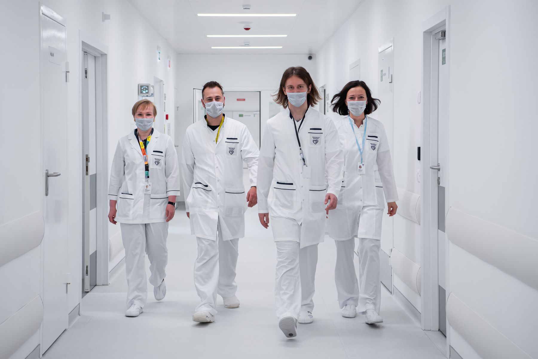 Doctors walking through a modern hospital corridor